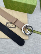 Gucci belt, pale pink strap and circular GG buckle; folded dust bag