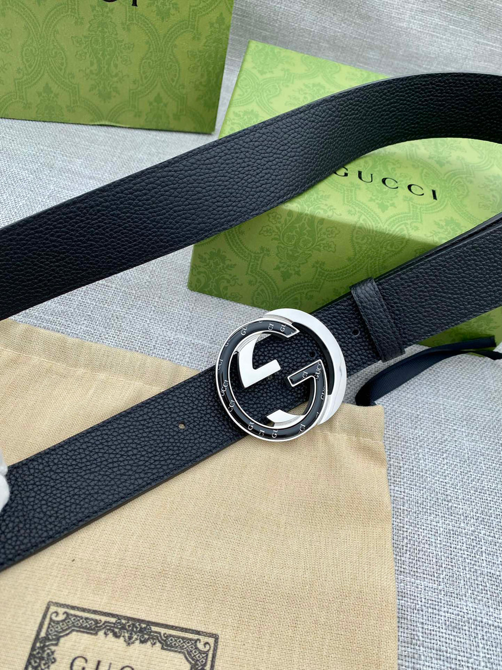 Gucci belt with black leather strap and silver-tone GG buckle