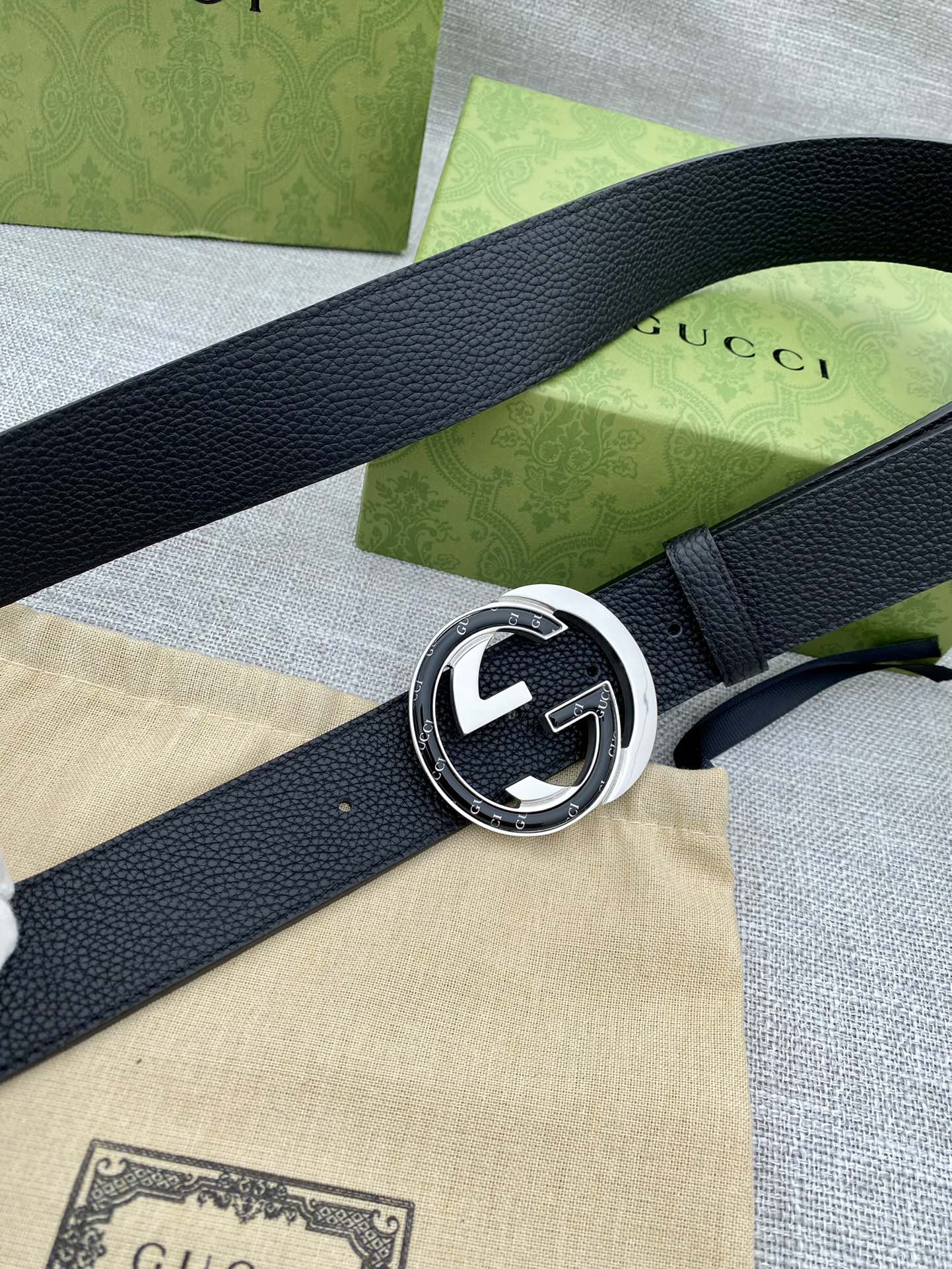 Gucci belt with black leather strap and silver-tone GG buckle