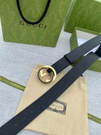 Gucci belt with black leather strap and gold-tone GG buckle with pin