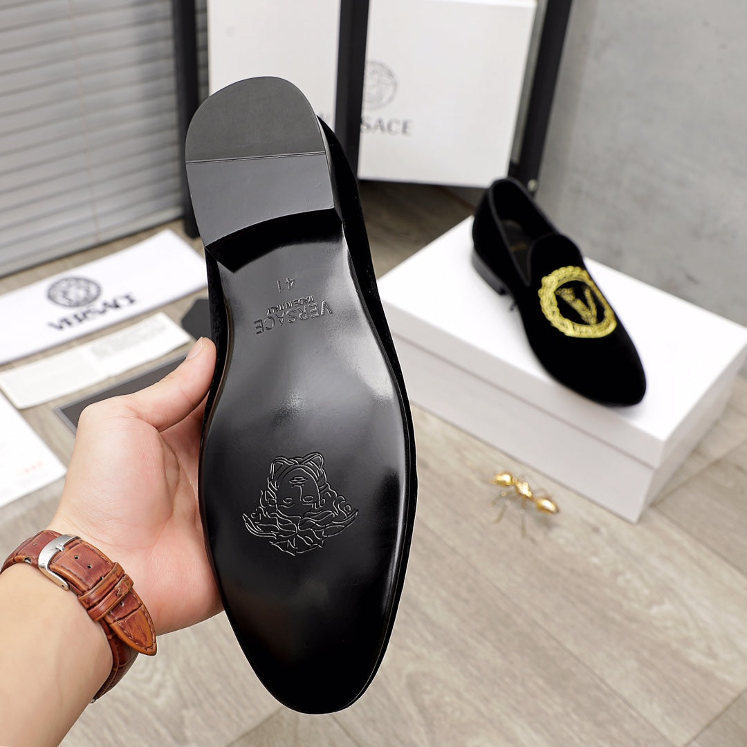 Versace black loafer sole with embossed logo and heel base