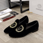 Versace black slip-on loafers with gold embroidered logo detail