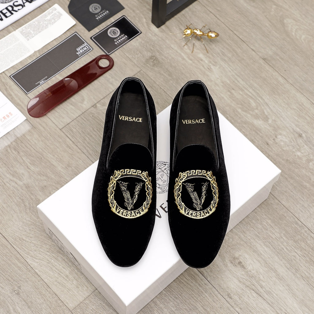 Versace black loafers with gold embroidered crest on the vamp