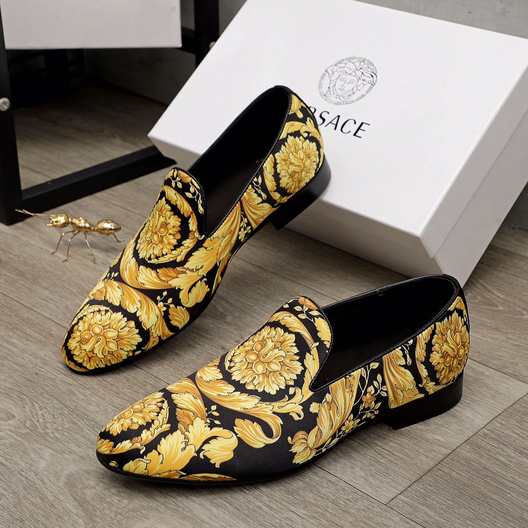 Luxury slip-on loafers in black with gold baroque floral print, pointed toe, low heel