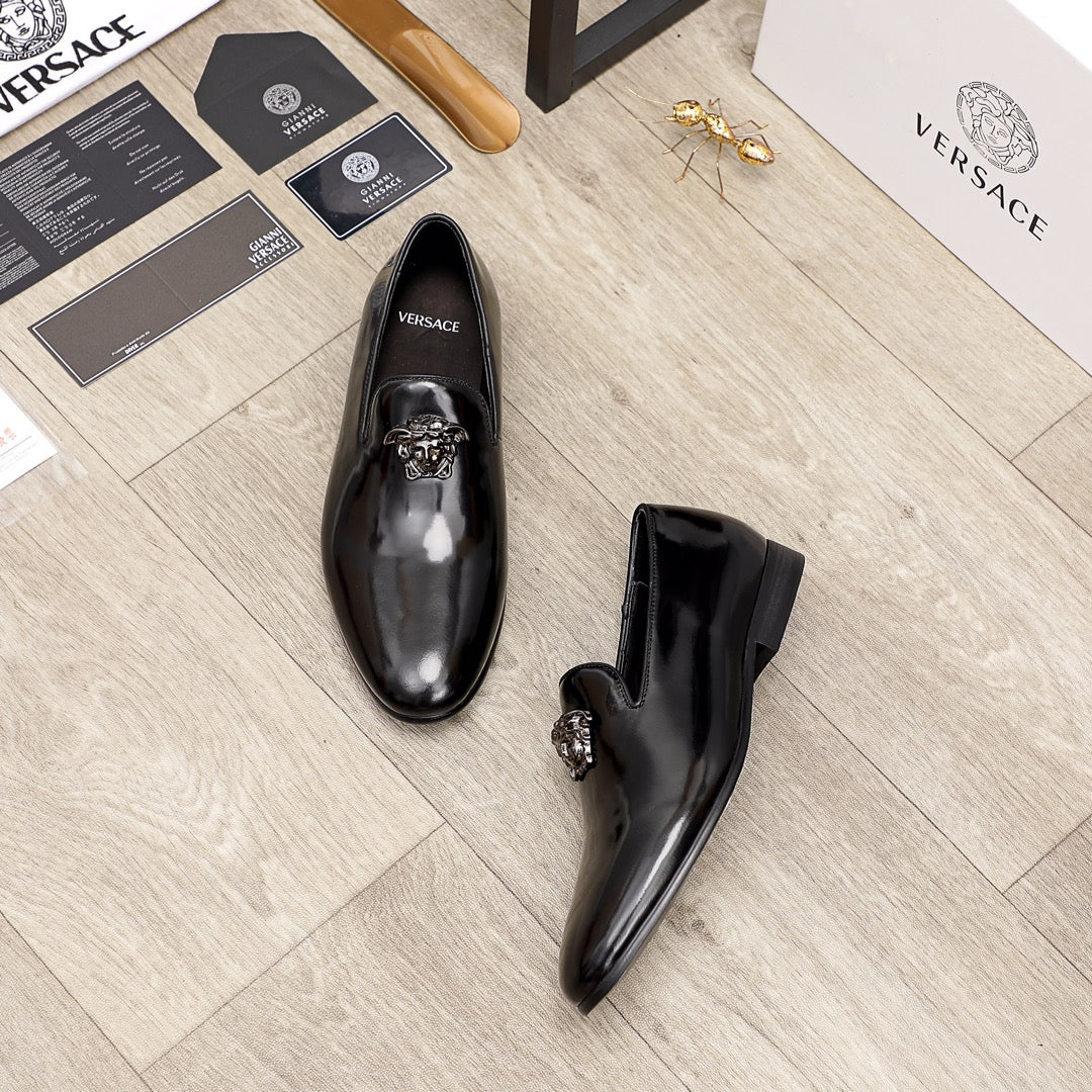 Versace black patent leather loafers, one slip-on and one side view