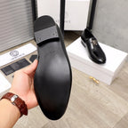 Versace black loafer sole and heel cap view, textured rubber tread