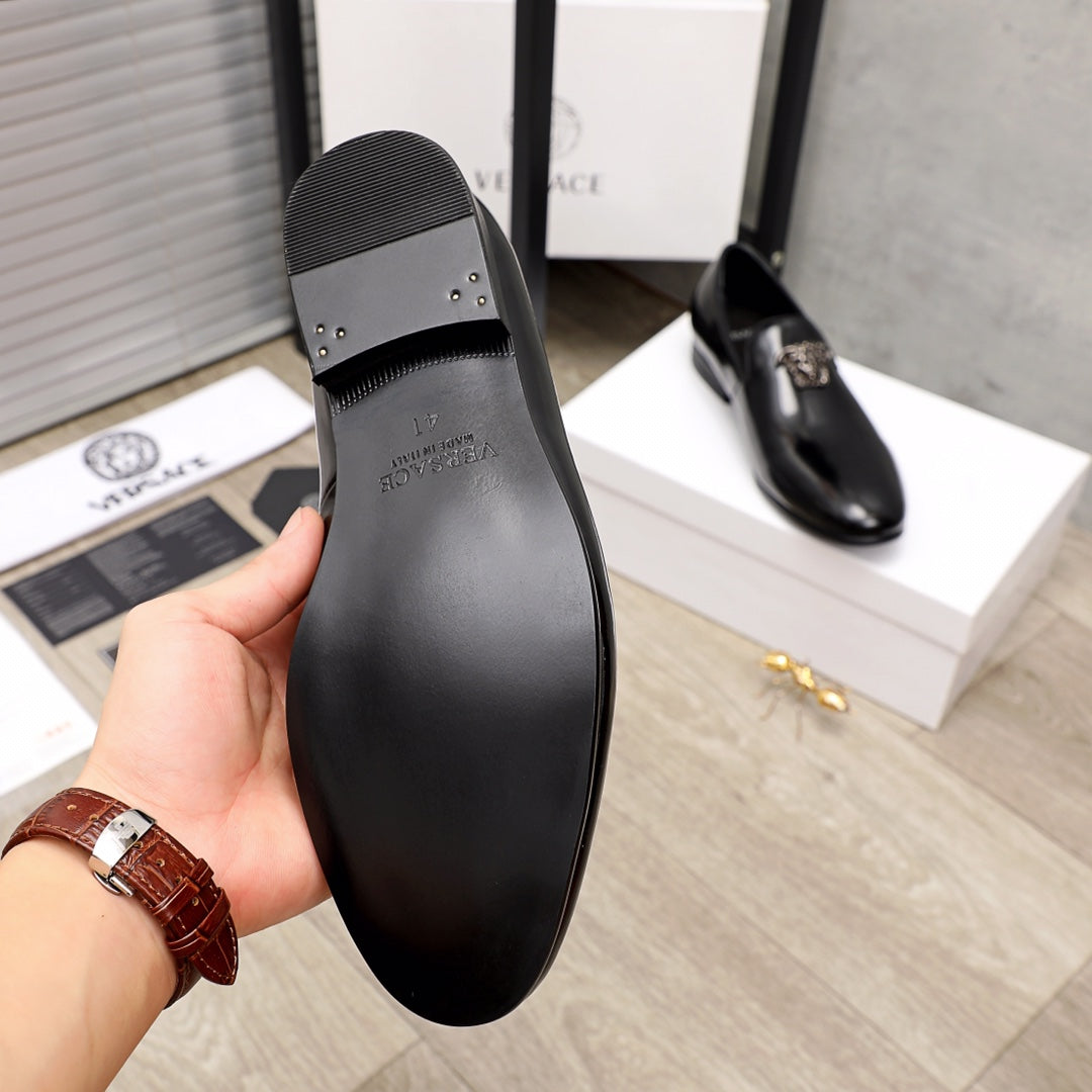 Versace black loafer sole and heel cap view, textured rubber tread