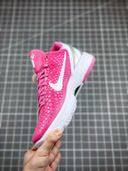 Pink lace-up basketball sneaker with white swoosh and textured upper, side view