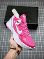 Pink basketball sneaker with white swoosh and textured upper, lace-up front view