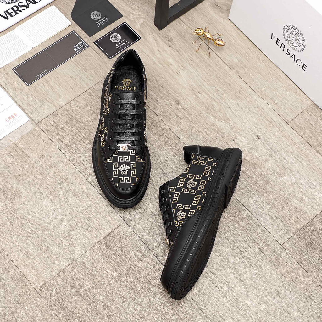 Versace sneakers set, black uppers with gold patterned detail and lace-up style