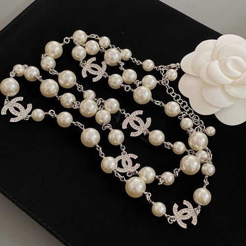 Layered pearl bead necklace set with silver-tone chain and CC pendant charms