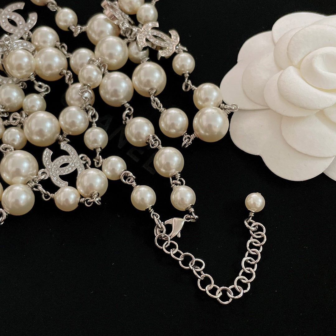 Pearl bead bracelet-style necklace with silver-tone chain and CC charms