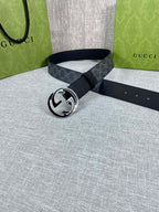 Gucci belt with dark GG monogram strap and silver-tone round double G buckle