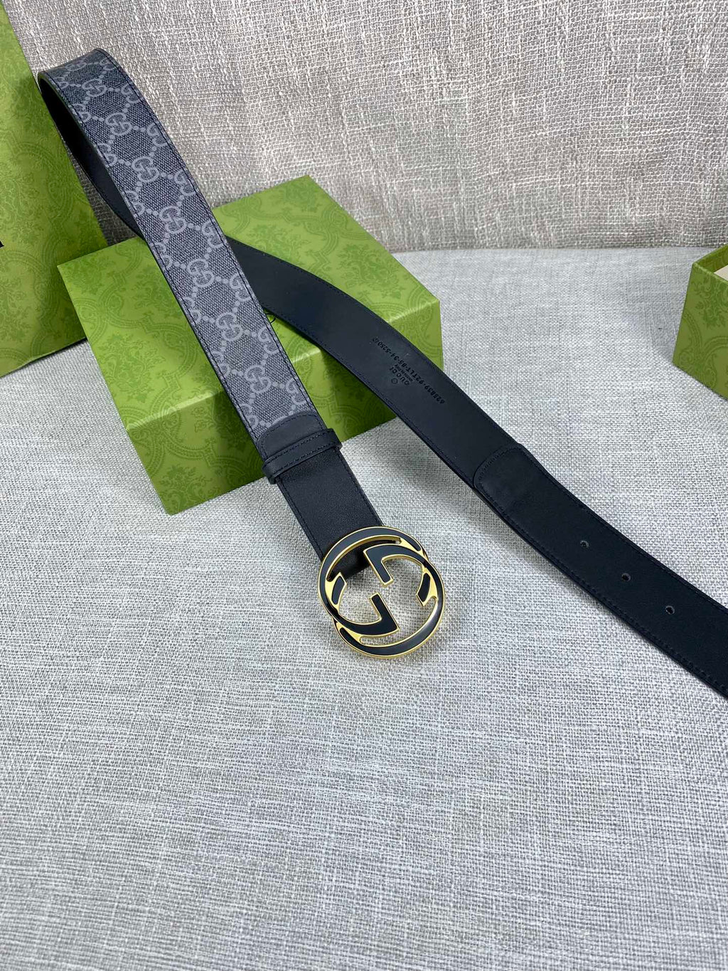 Gucci belt with dark strap and gold-tone round double G buckle