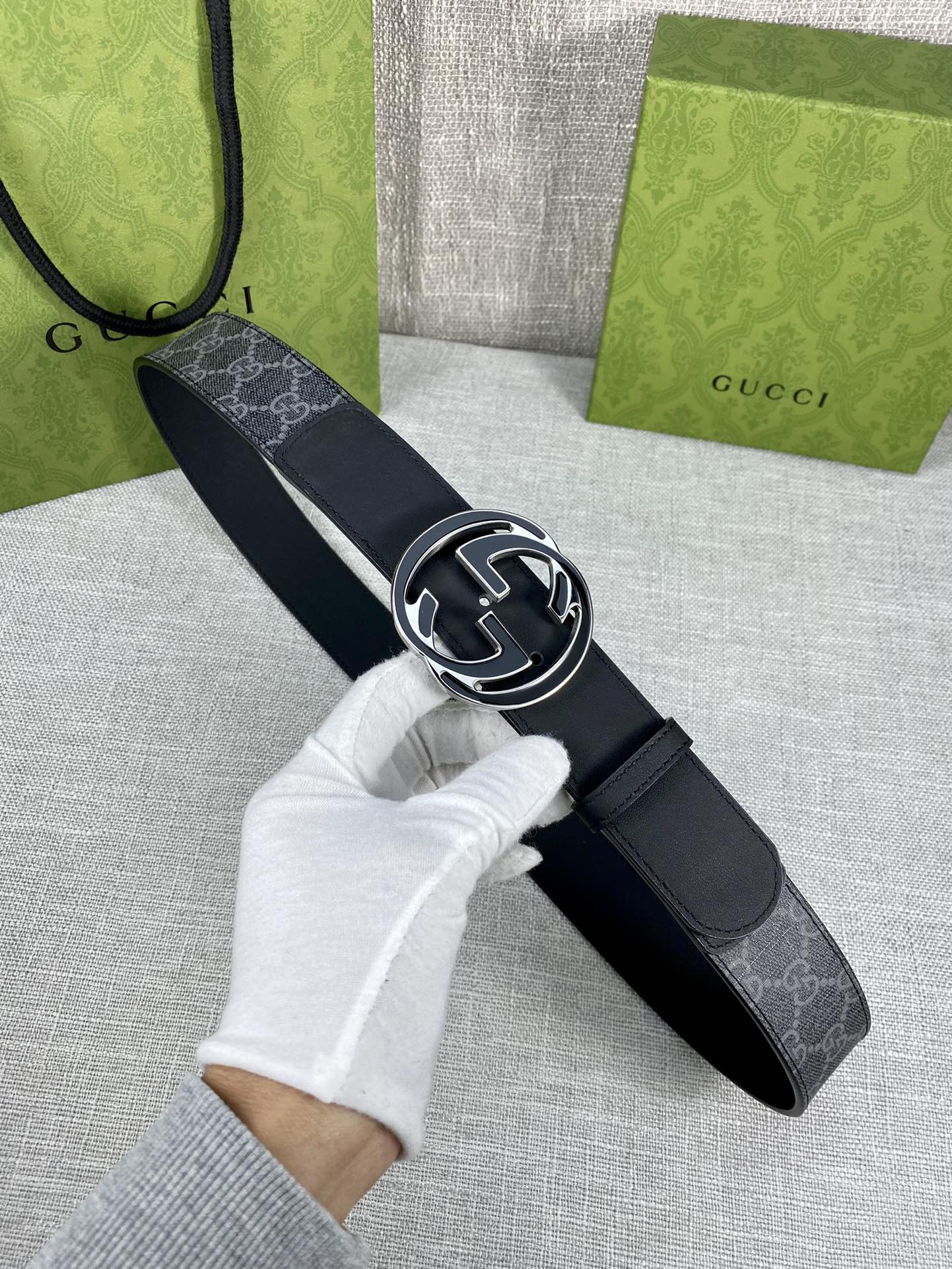 Gucci belt with navy monogram strap and silver-tone double G buckle