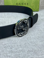 Gucci belt with smooth dark leather strap and silver-tone round double G buckle