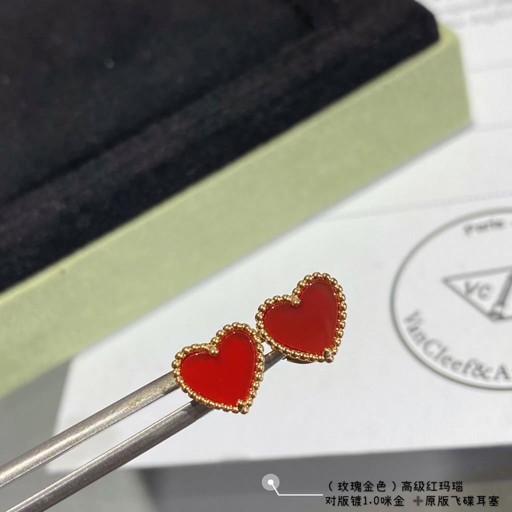 Heart stud earrings with red enamel hearts and gold-tone crystal halo, held on tools