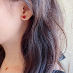 Heart stud earrings with red enamel center and gold-tone crystal border