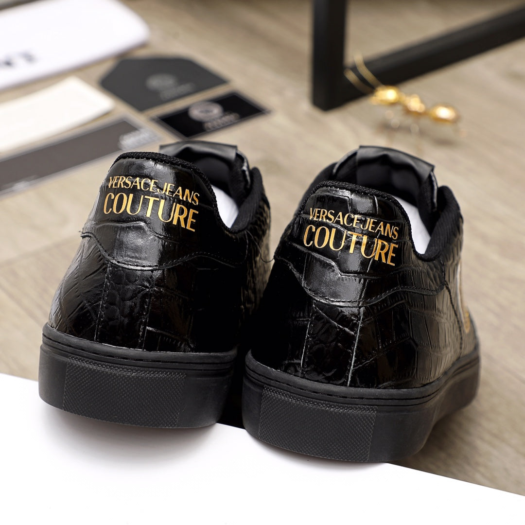 Black Versace sneakers, rear view with gold 'Couture' logo text on heel