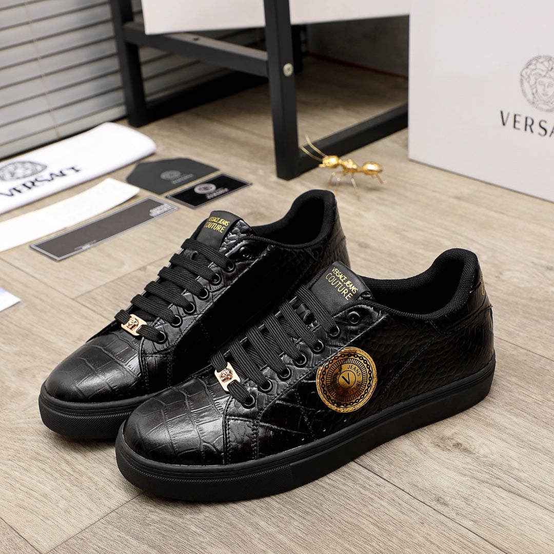 Black Versace sneakers with gold emblem and lace-up front