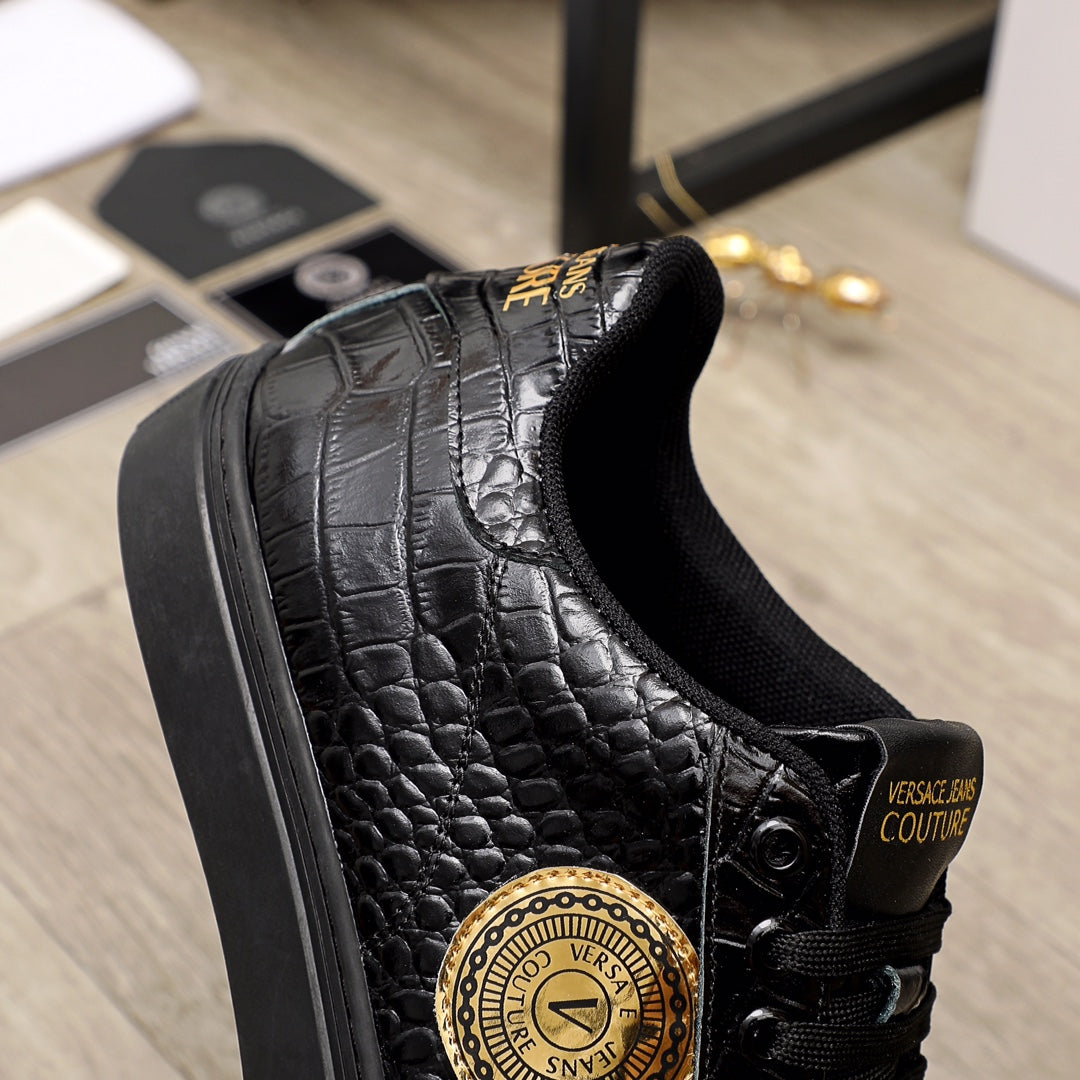 Black Versace sneakers with embossed texture, gold logo medallion and lace-up