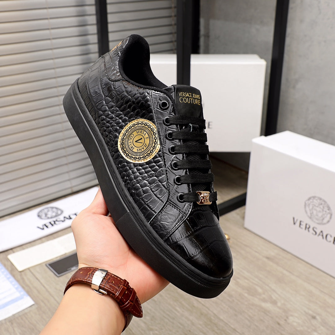 Black Versace sneakers with embossed texture and gold round logo at side