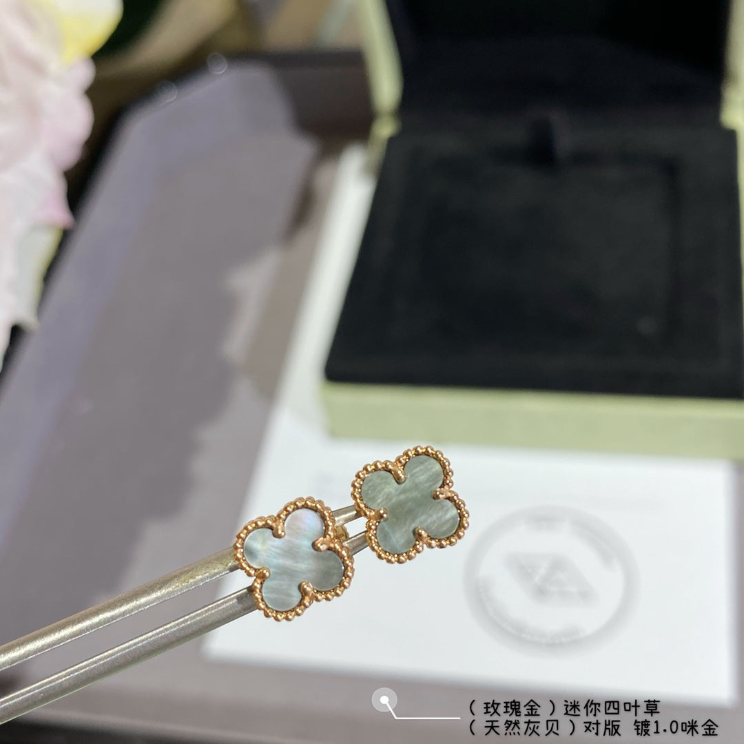 Van Cleef & Arpels clover stud earrings, light blue enamel on gold-tone posts