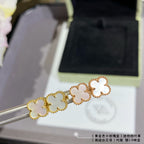 Van Cleef & Arpels clover stud earrings, white enamel on gold-tone posts