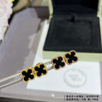 Van Cleef & Arpels clover stud earrings, black enamel on gold-tone posts