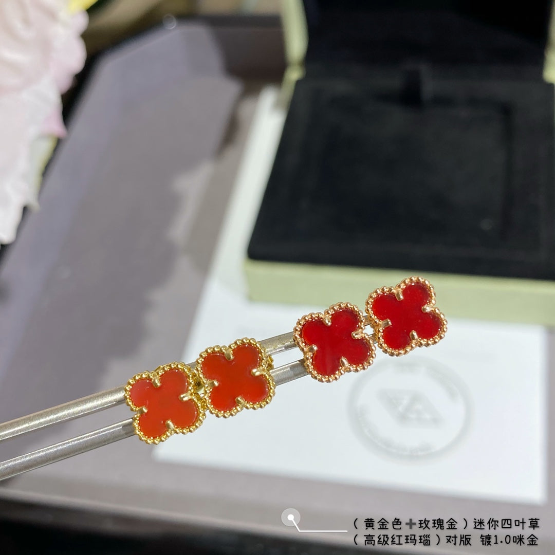 Van Cleef & Arpels clover stud earrings, red enamel on gold-tone posts