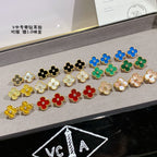 Clover-shaped stud earrings set with gold-tone outlines in black, white, blue, green, yellow
