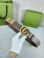 Gucci belt with beige GG canvas and dark brown leather, gold double-G buckle