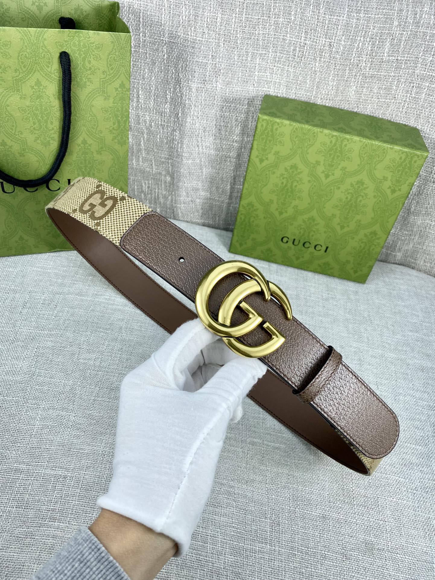 Gucci belt with beige GG canvas and dark brown leather, gold double-G buckle