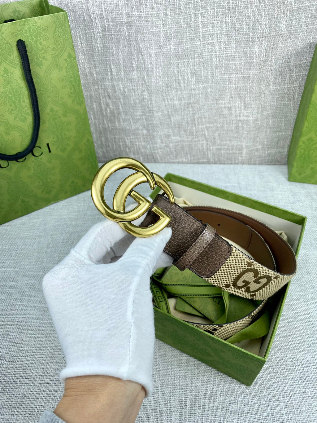 Gucci belt with gold double-G buckle, beige GG canvas and dark brown leather strap