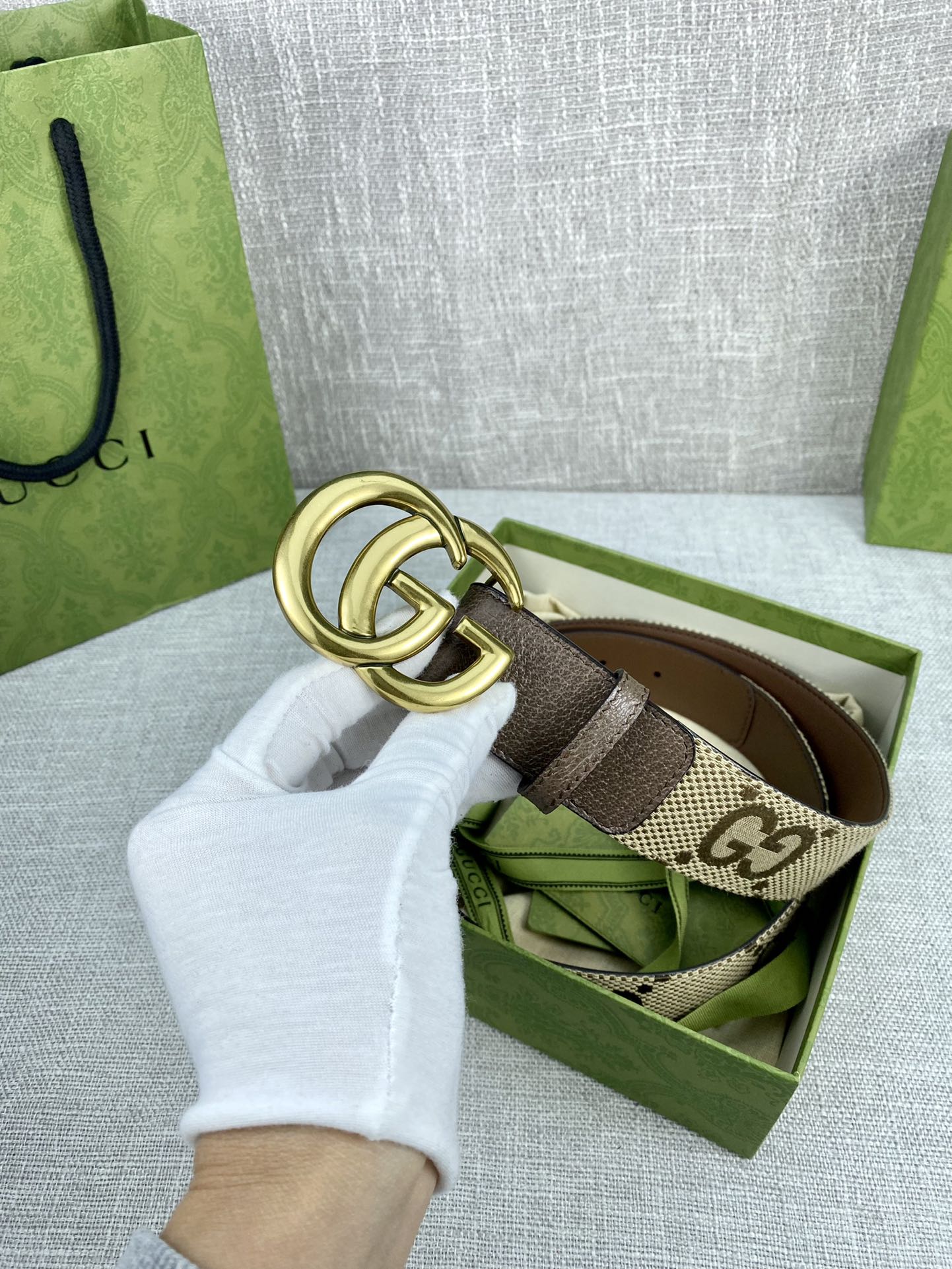 Gucci belt with gold double-G buckle, beige GG canvas and dark brown leather strap