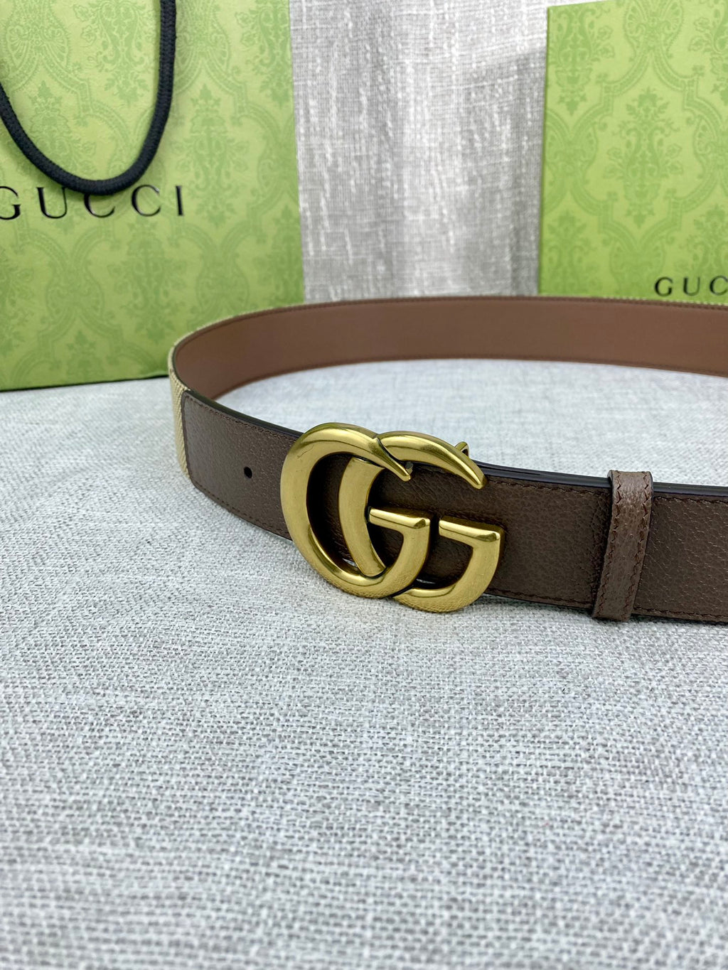 Gucci belt with dark brown leather strap and gold double-G buckle