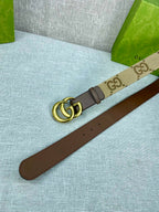 Gucci belt with beige GG canvas strap, gold buckle, dark brown leather underside