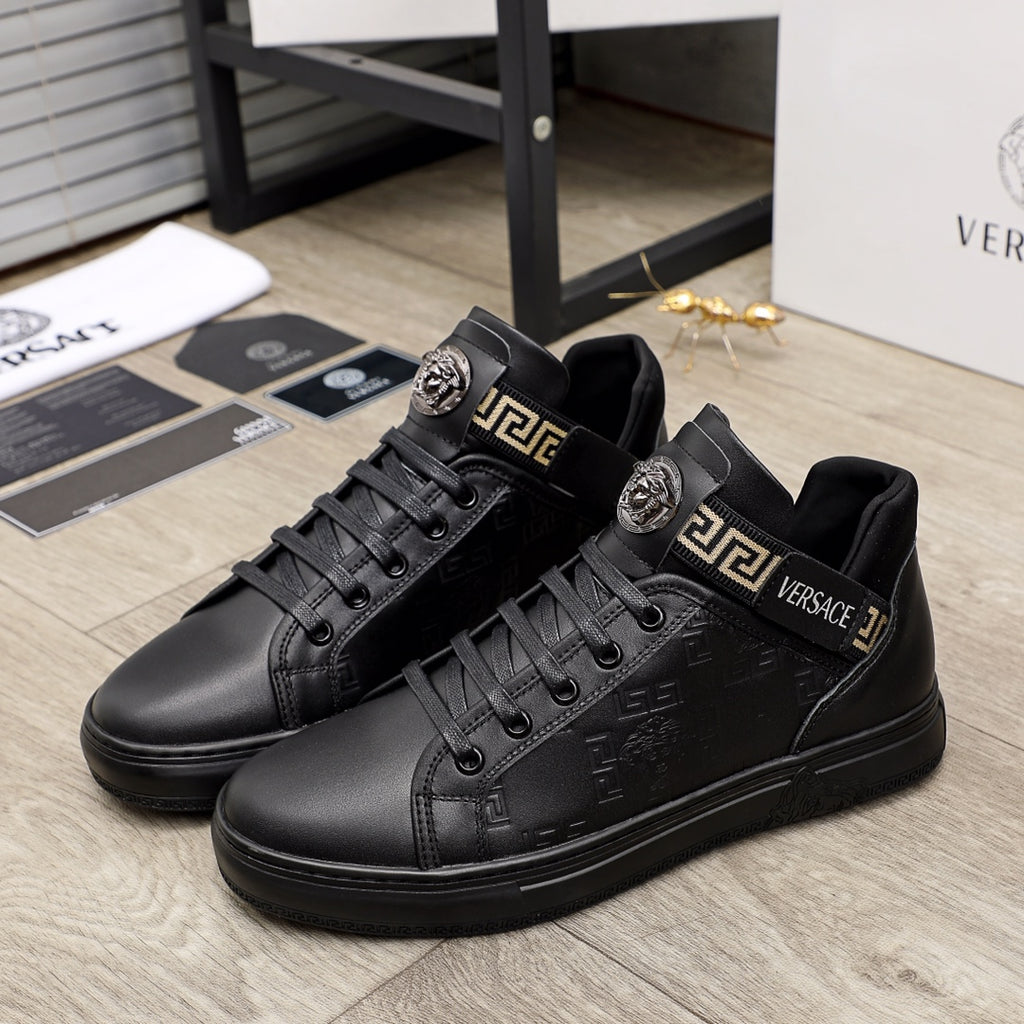 Black Versace leather sneakers with gold logo strap and front lace-up