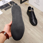 Black Versace sneakers with textured rubber sole underside and side view