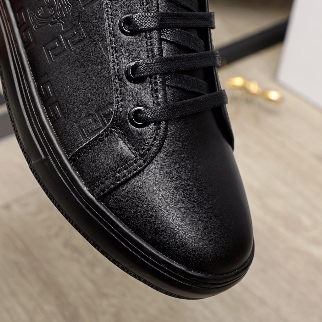 Black Versace sneaker toe and laces close-up; smooth leather upper