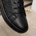 Black Versace sneaker toe and laces close-up; smooth leather upper