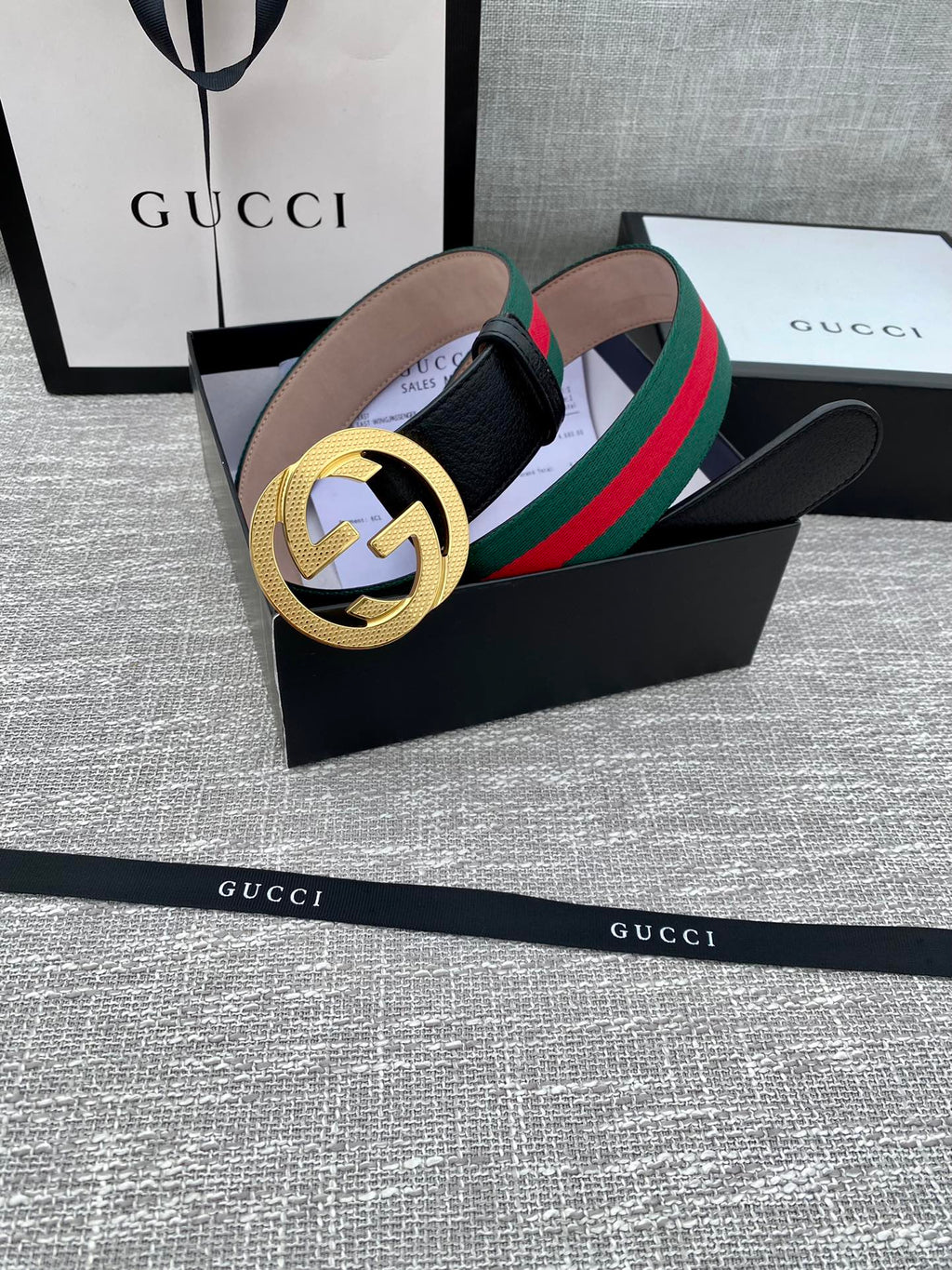 Leather belt with gold GG buckle, black strap, green and red web stripe