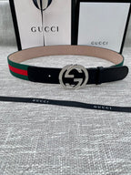 Leather belt with black strap, silver GG buckle, green and red web stripe trim
