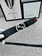Black leather belt with silver GG buckle and green-red web stripe detail