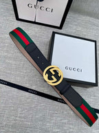 Black leather belt with gold GG buckle and green-red web stripe trim