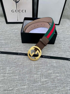Brown leather Gucci belt with gold-tone GG buckle and green/red web stripe, in box