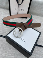 Gucci belt with brown leather, gold-tone GG buckle, and green/red web stripe on box