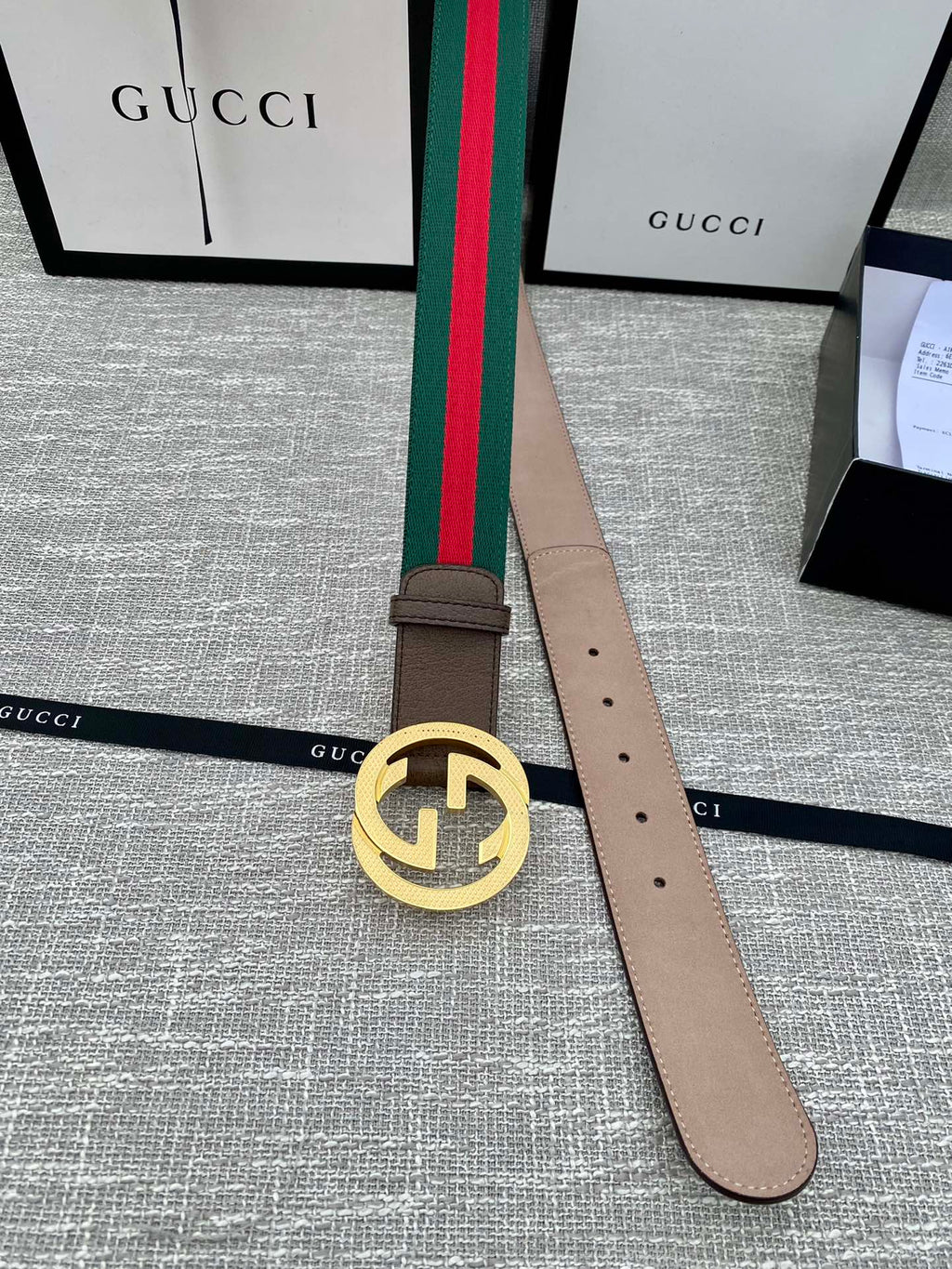 Brown leather belt with gold-tone GG buckle and green/red web stripe, end with holes