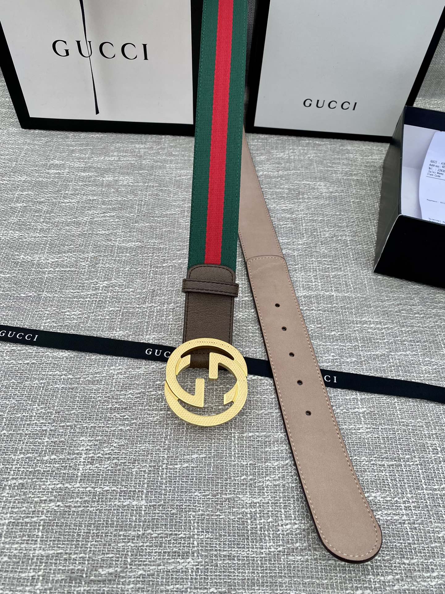 Brown leather belt with gold-tone GG buckle and green/red web stripe, end with holes
