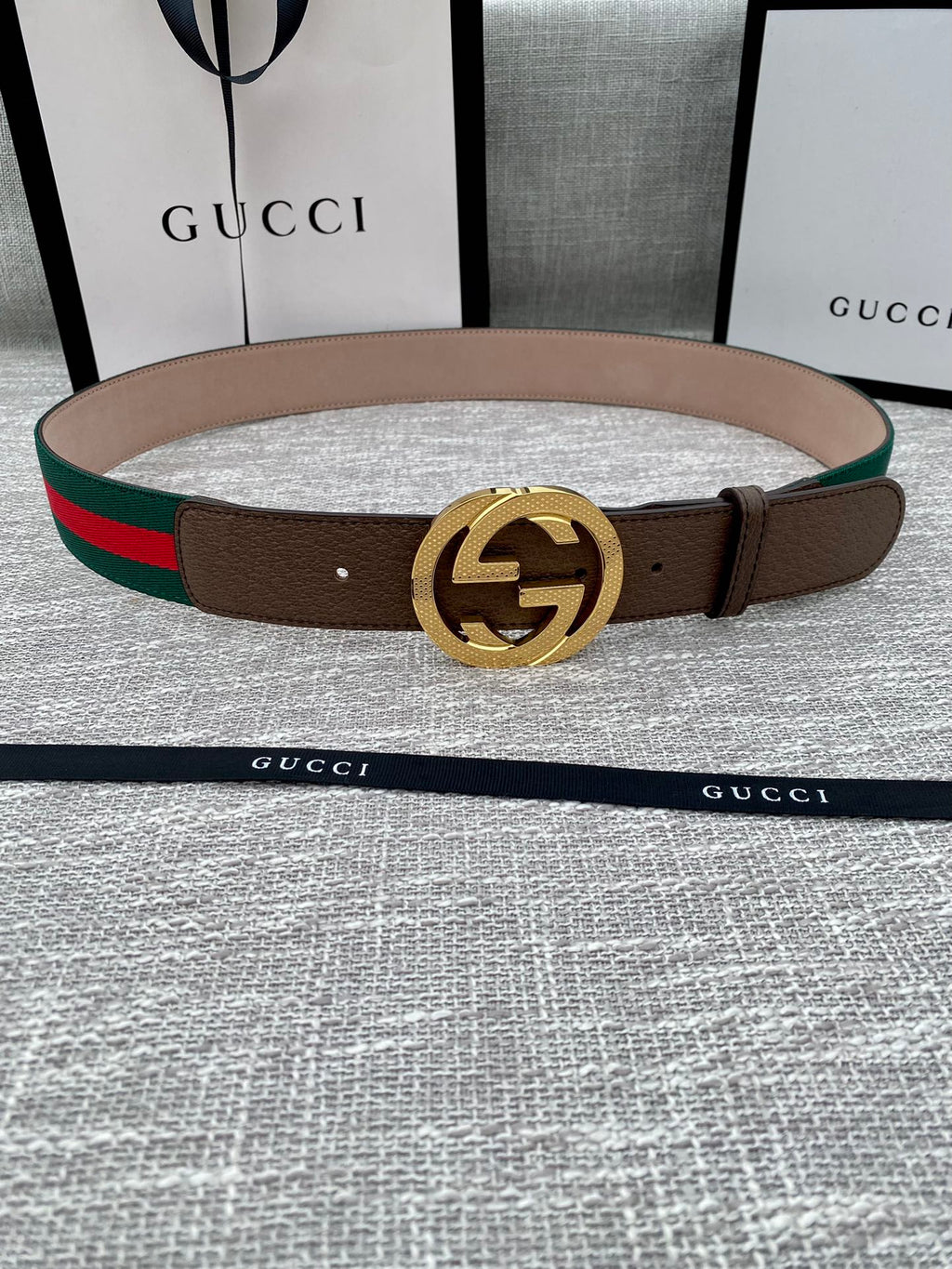 Gucci belt in brown leather with gold-tone GG buckle and green/red web stripe